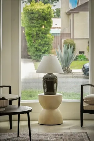 a view of a sink with a table and chair in a room