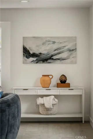 a room with furniture and a potted plant