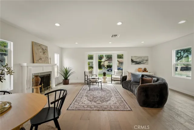 a living room with fireplace furniture and a fireplace