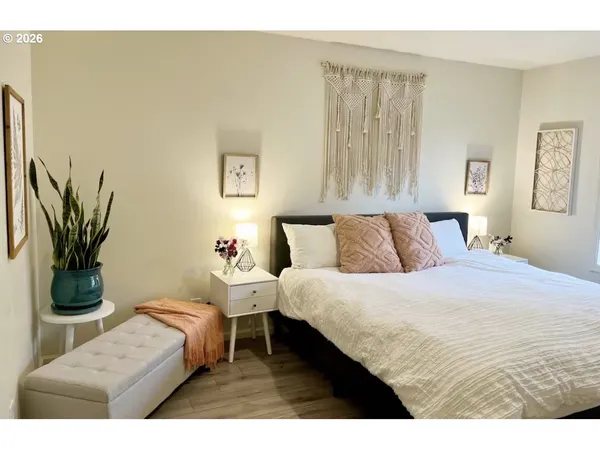 a bedroom with a bed and a couch