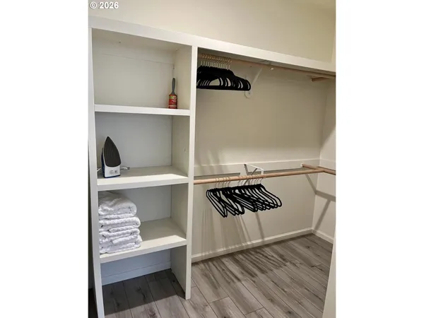 a bedroom with furniture and a window