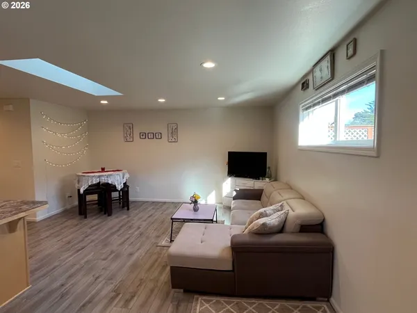 a view of a livingroom with furniture and wooden floor