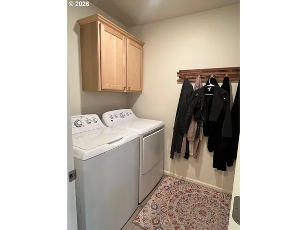 a bedroom with a bed and a tv with wooden floor