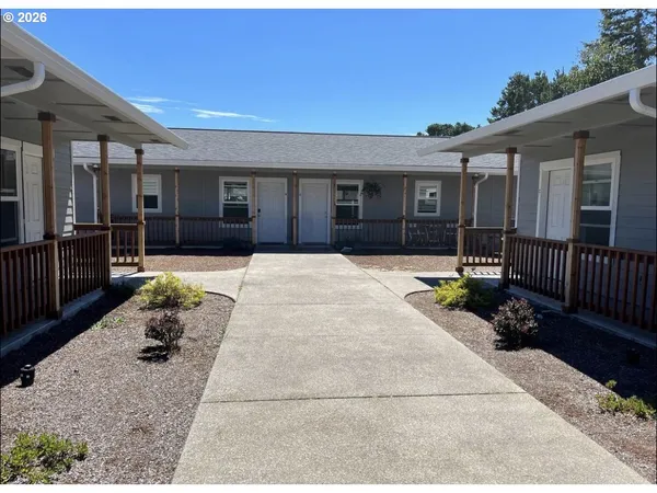 a swimming pool with outdoor seating