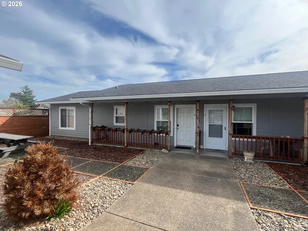 a front view of a house with a patio