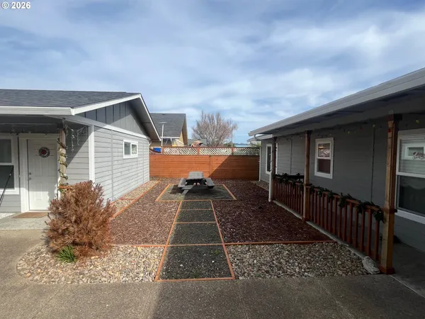 a front view of a house with parking space