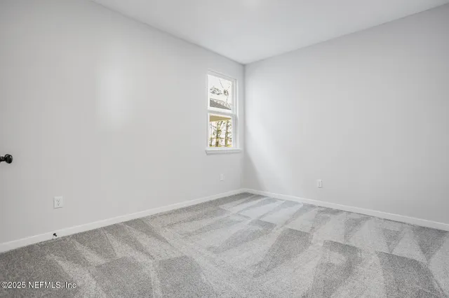 a view of an empty room with window