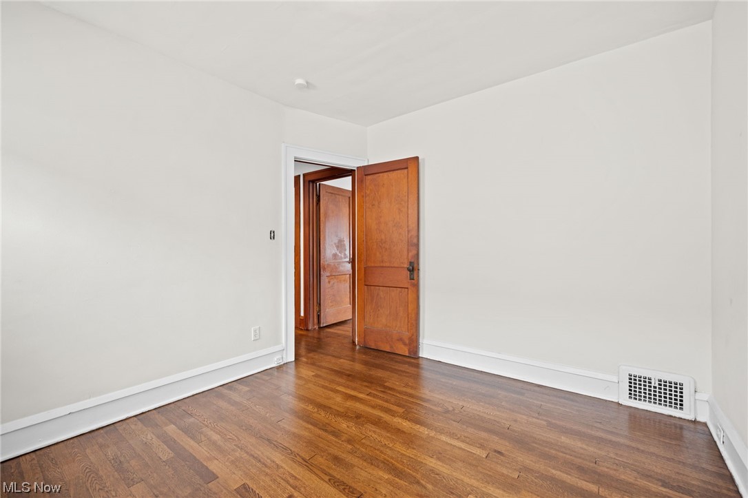 3561 Warren Road Cleveland, OH 44111 - Photo 14 of 28 Bedroom with dark hardwood / wood-style floors