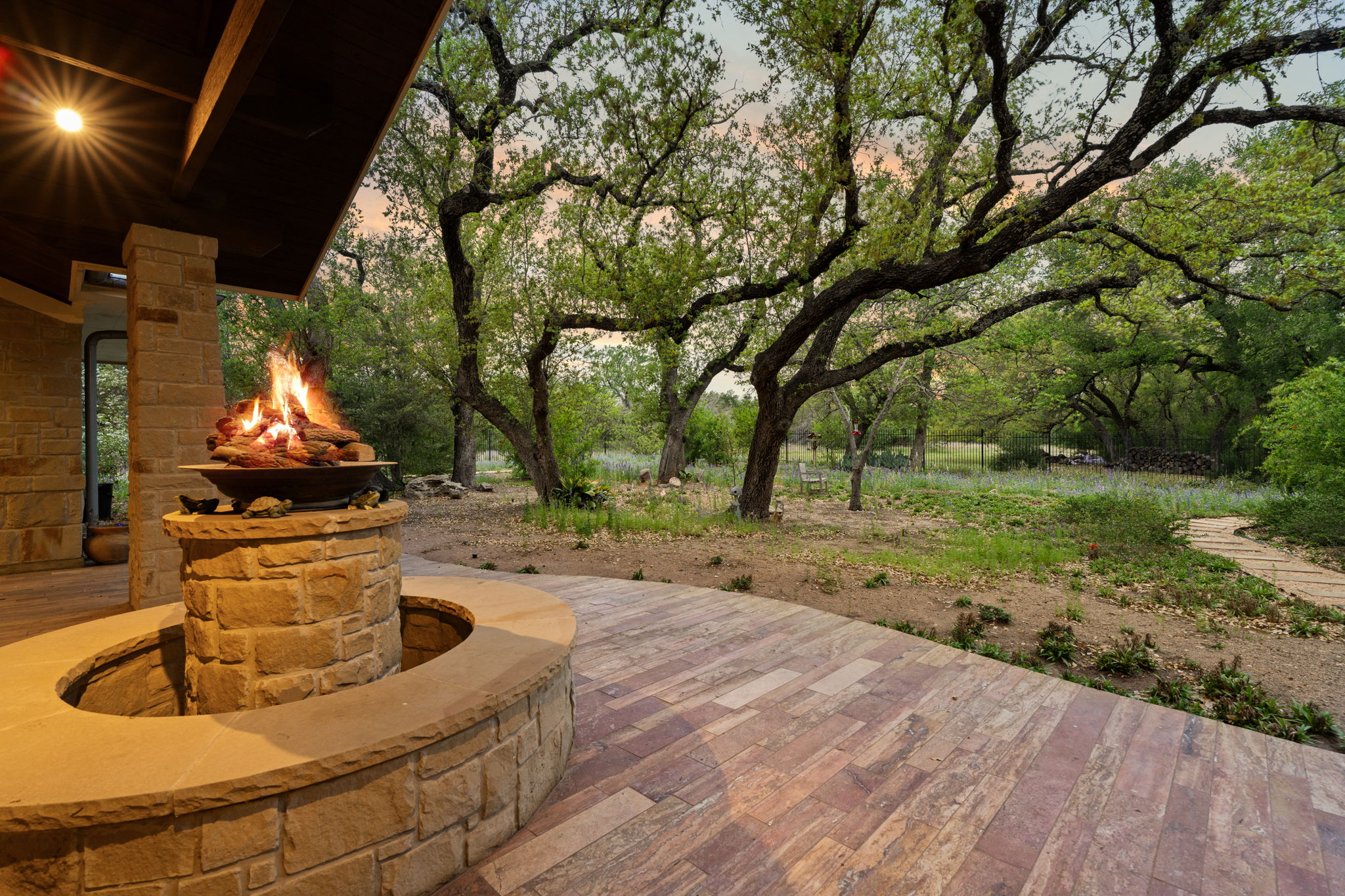 23426 Oscar Road Spicewood, TX 78669 - Photo 21 of 40 The view from the covered patio is stunning! Notice the waterfall/fire pit.
