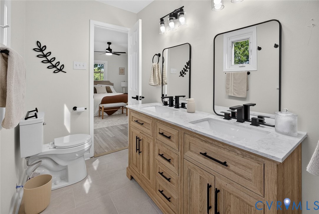 6581 Rural Point Road Mechanicsville, VA 23116 - Photo 16 of 58 Double vanity with a white countertop, dual underm