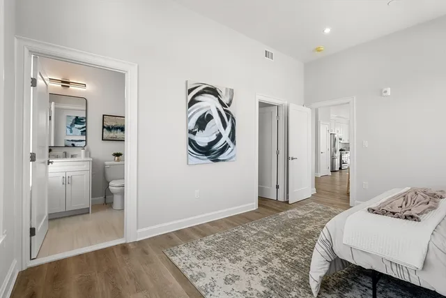 a bathroom with a toilet a sink and shower
