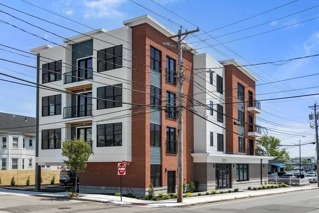 a front view of a building with street view