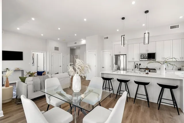 a living room with fireplace furniture and a flat screen tv