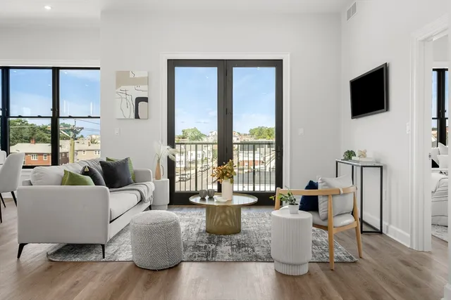 a spacious bedroom with a large bed and a large window