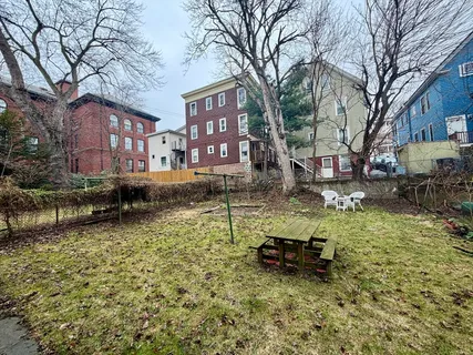 a backyard of a house with lots of green space