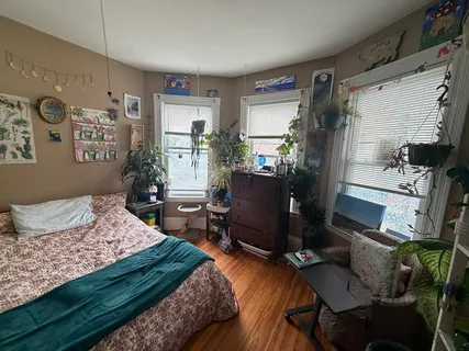 a bedroom with a bed and furniture