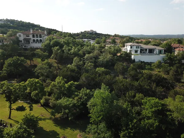 an aerial view of residential houses with city view and lake view