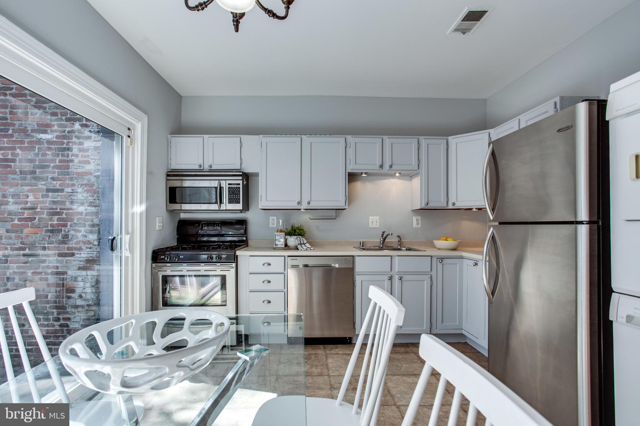 241 Warren Street Northeast Washington, DC 20002 - Photo 14 of 43 Kitchen/dining area is bright and spacious