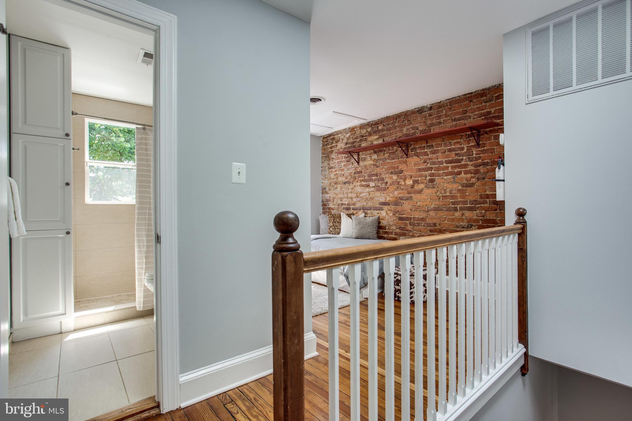 241 Warren Street Northeast Washington, DC 20002 - Photo 21 of 43 Stair hall looking toward open den/office (2nd BR)