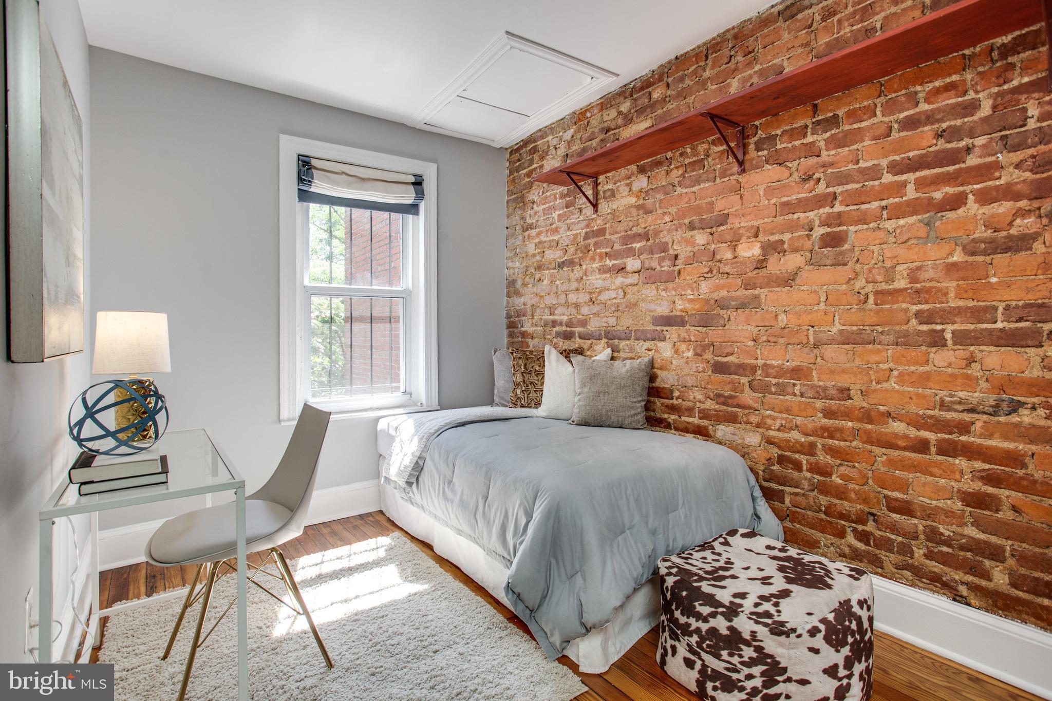 241 Warren Street Northeast Washington, DC 20002 - Photo 23 of 43 Exposed brick and beautiful wood floor in 2nd BR