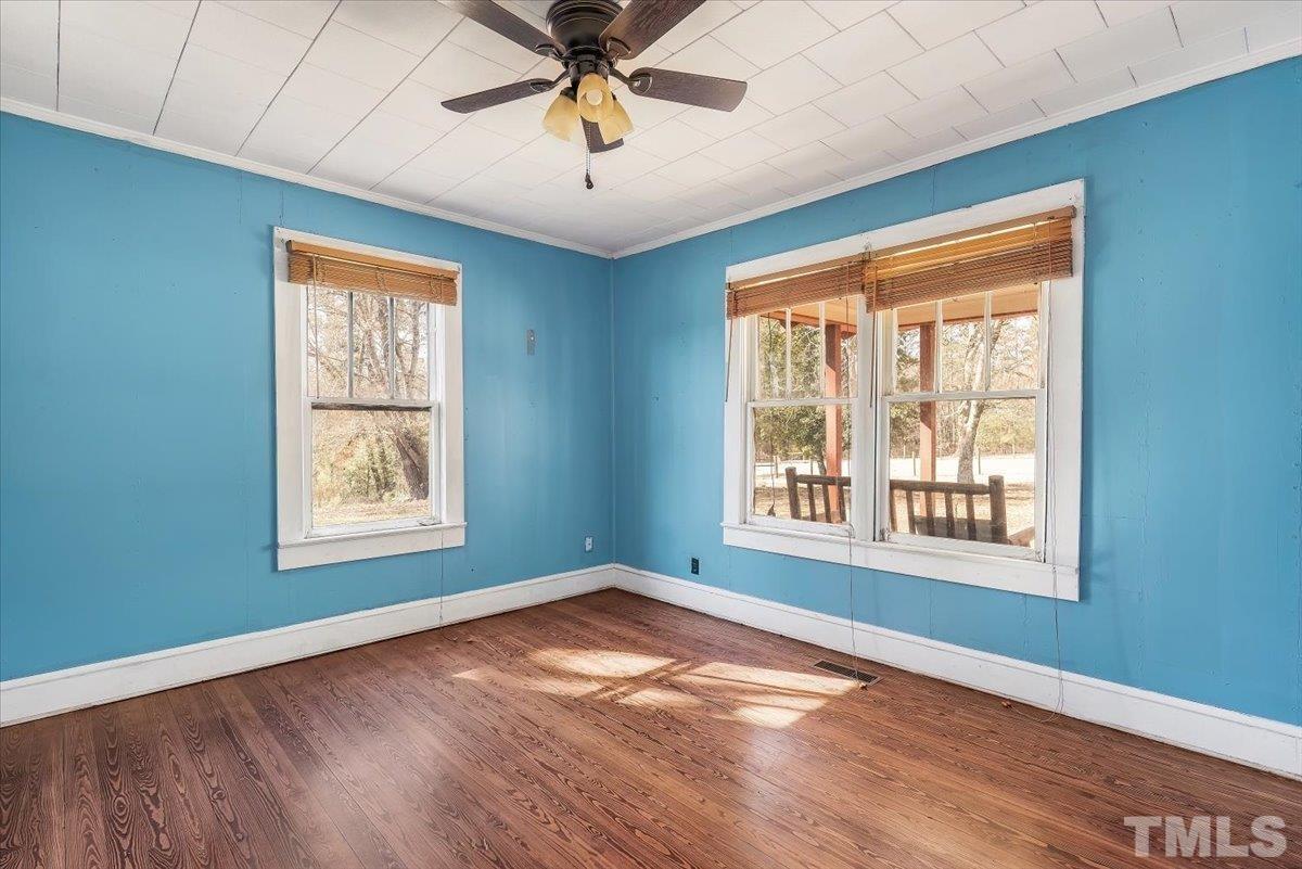 1899 Jason Road Seagrove, NC 27341 - Photo 12 of 51 a view of an empty room with a window and wooden floor