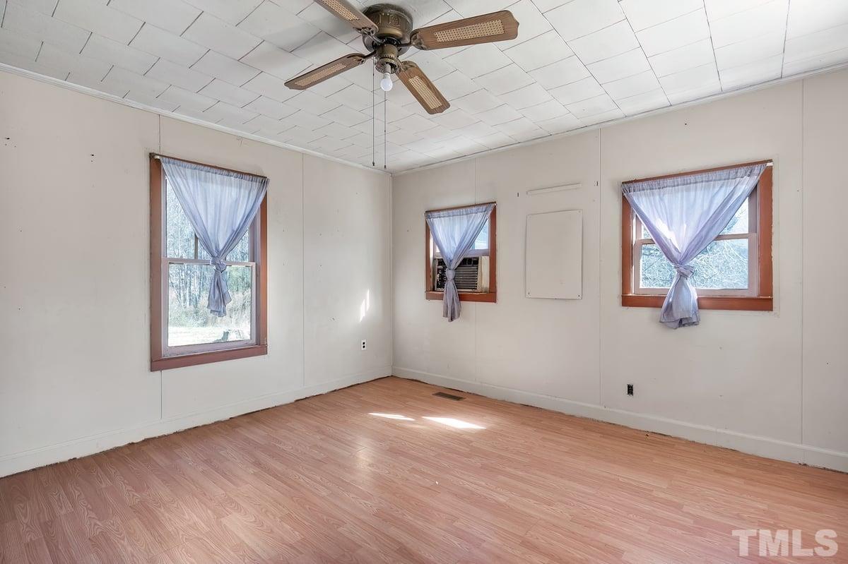 1899 Jason Road Seagrove, NC 27341 - Photo 22 of 51 a view of an empty room with a window and wooden floor