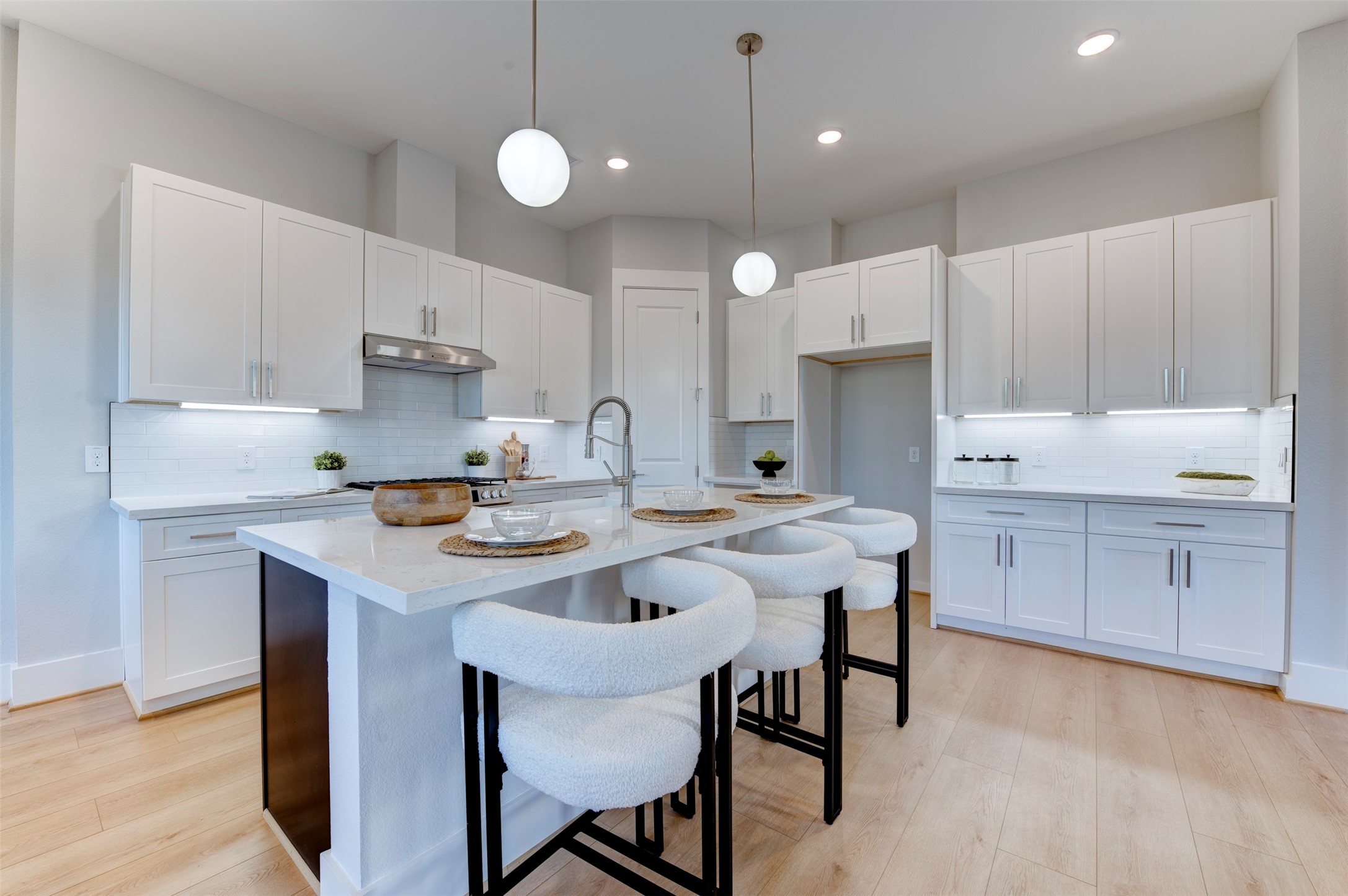 5132 Rosslyn Road Houston, TX 77018 - Photo 12 of 40 a kitchen with a sink a stove a refrigerator and white cabinets