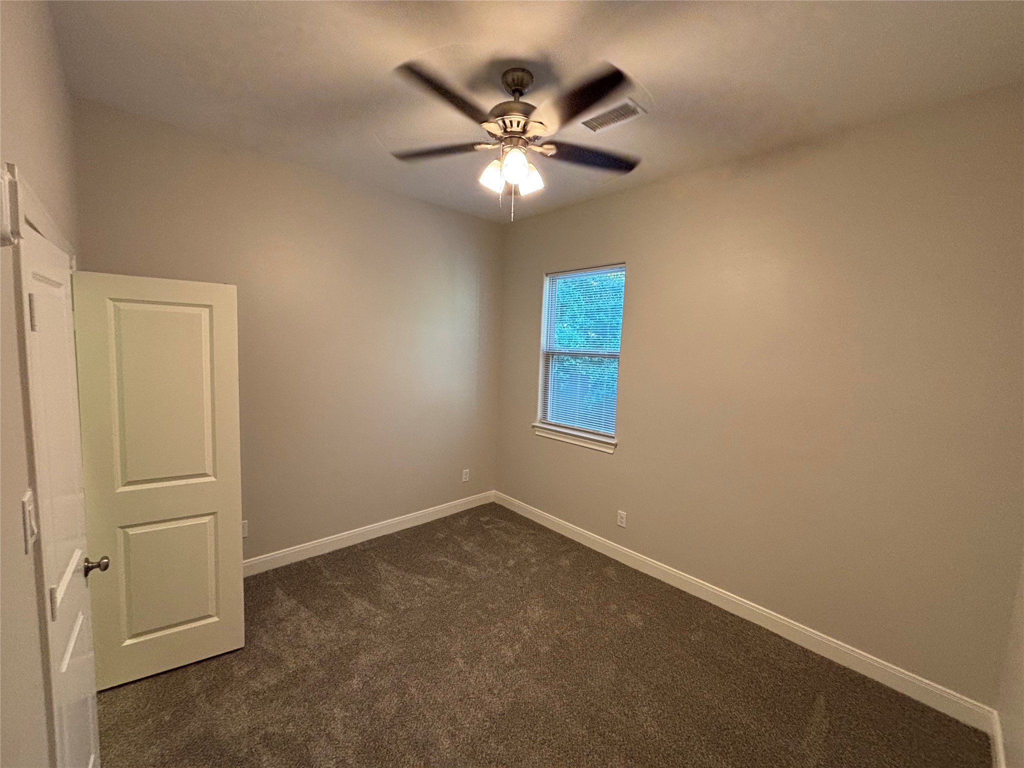 504 Nursery Road, Unit 1108 The Woodlands, TX 77380 - Photo 11 of 25 a view of an empty room with a window