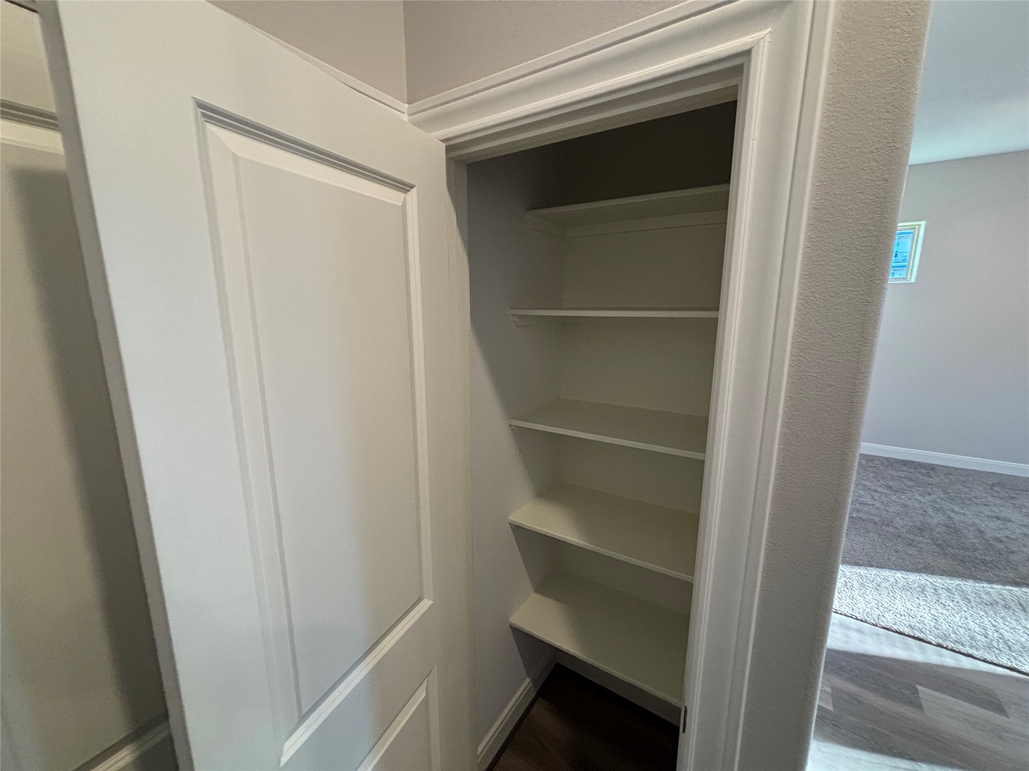 504 Nursery Road, Unit 1108 The Woodlands, TX 77380 - Photo 2 of 25 a view of walk in closet with empty racks