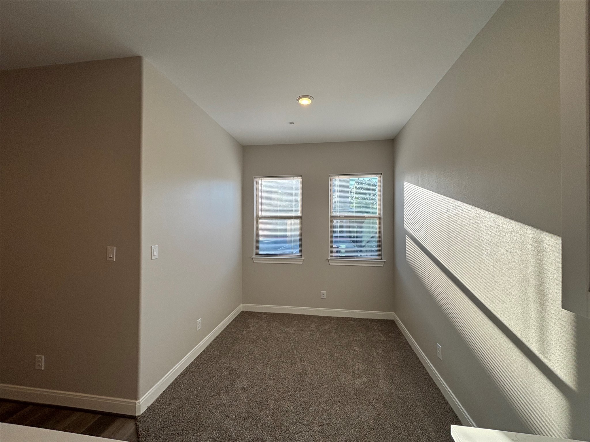 504 Nursery Road, Unit 1108 The Woodlands, TX 77380 - Photo 21 of 25 a view of an empty room with a window