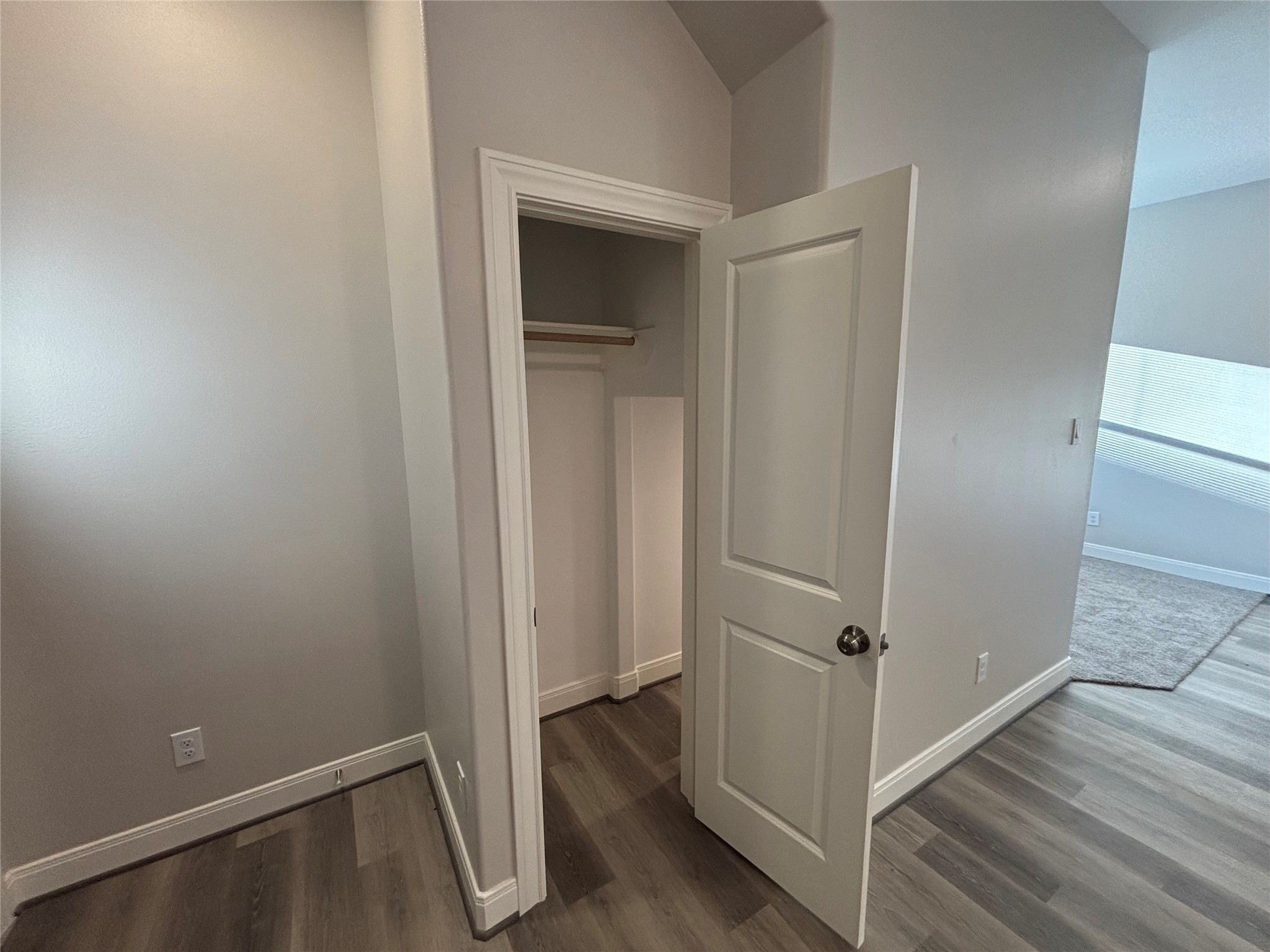 504 Nursery Road, Unit 1108 The Woodlands, TX 77380 - Photo 23 of 25 an empty room with wooden floor