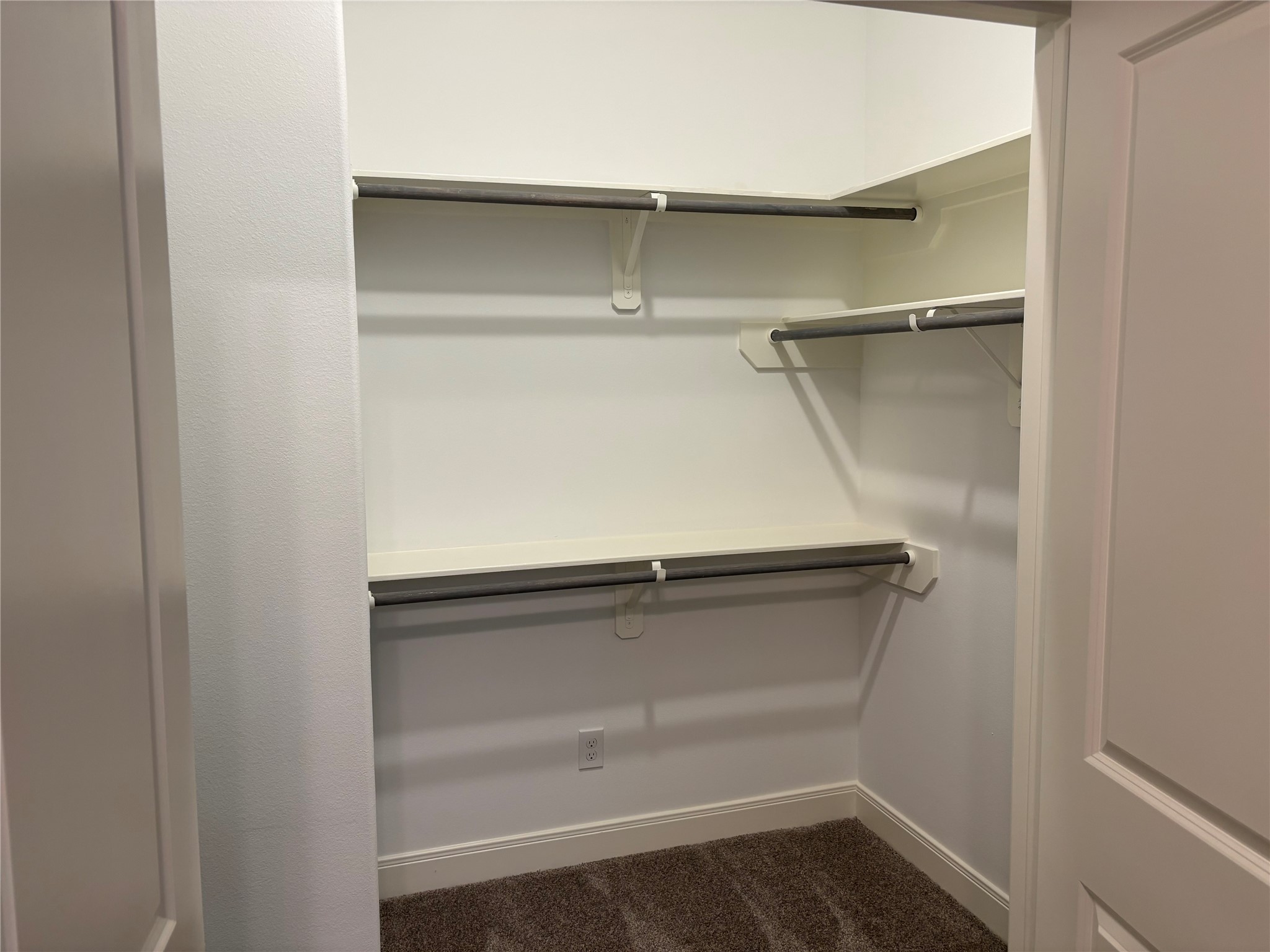 504 Nursery Road, Unit 1108 The Woodlands, TX 77380 - Photo 10 of 25 a empty closet with white paint