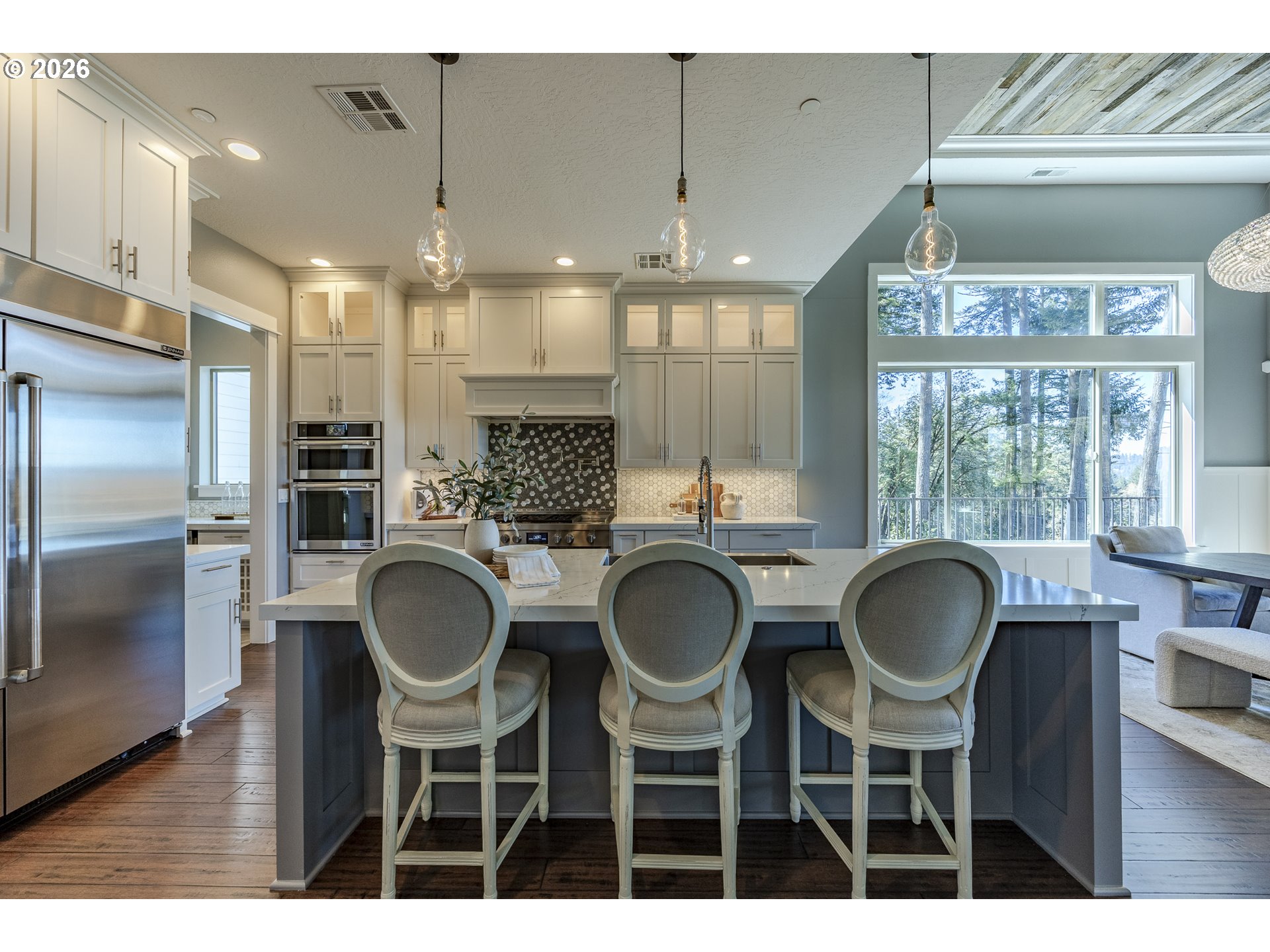 4048 Eagle View Drive Eugene, OR 97405 - Photo 17 of 48 a kitchen with kitchen island granite countertop a table and chairs
