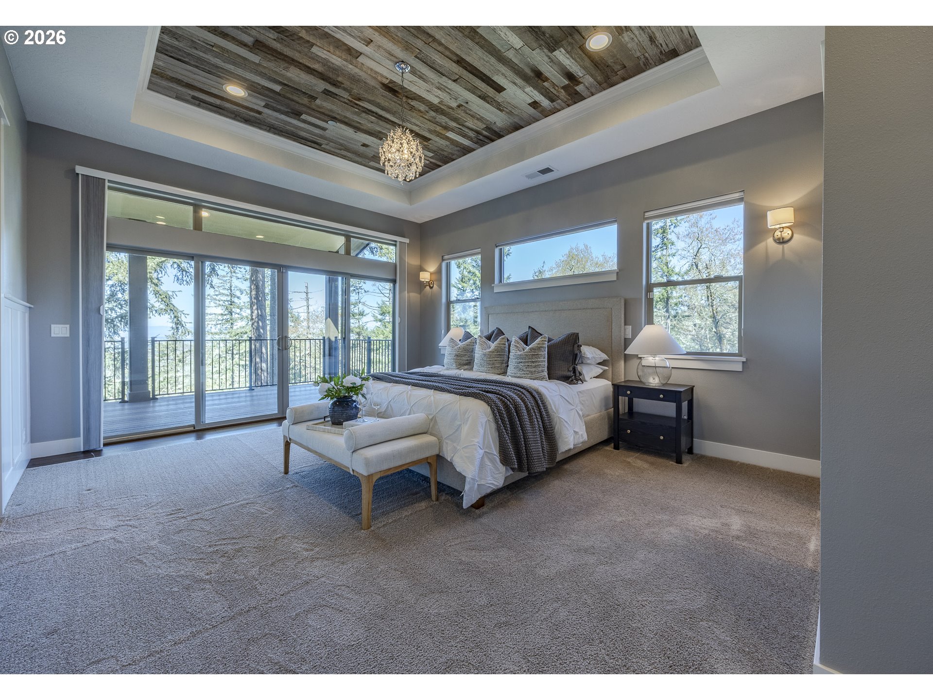 4048 Eagle View Drive Eugene, OR 97405 - Photo 23 of 48 a spacious bedroom with a bed and a large window