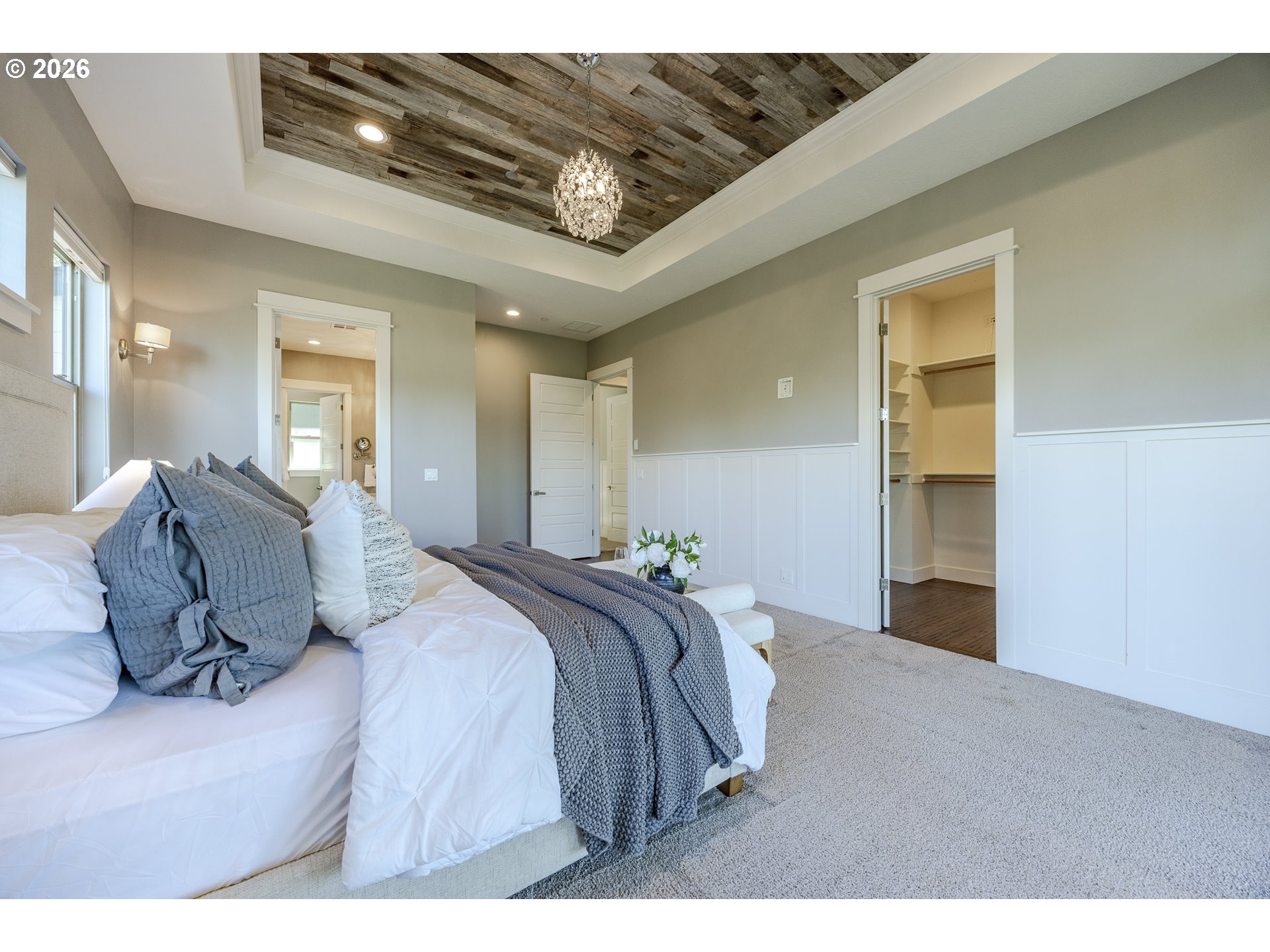 4048 Eagle View Drive Eugene, OR 97405 - Photo 24 of 48 a spacious bedroom with a bed and a chandelier