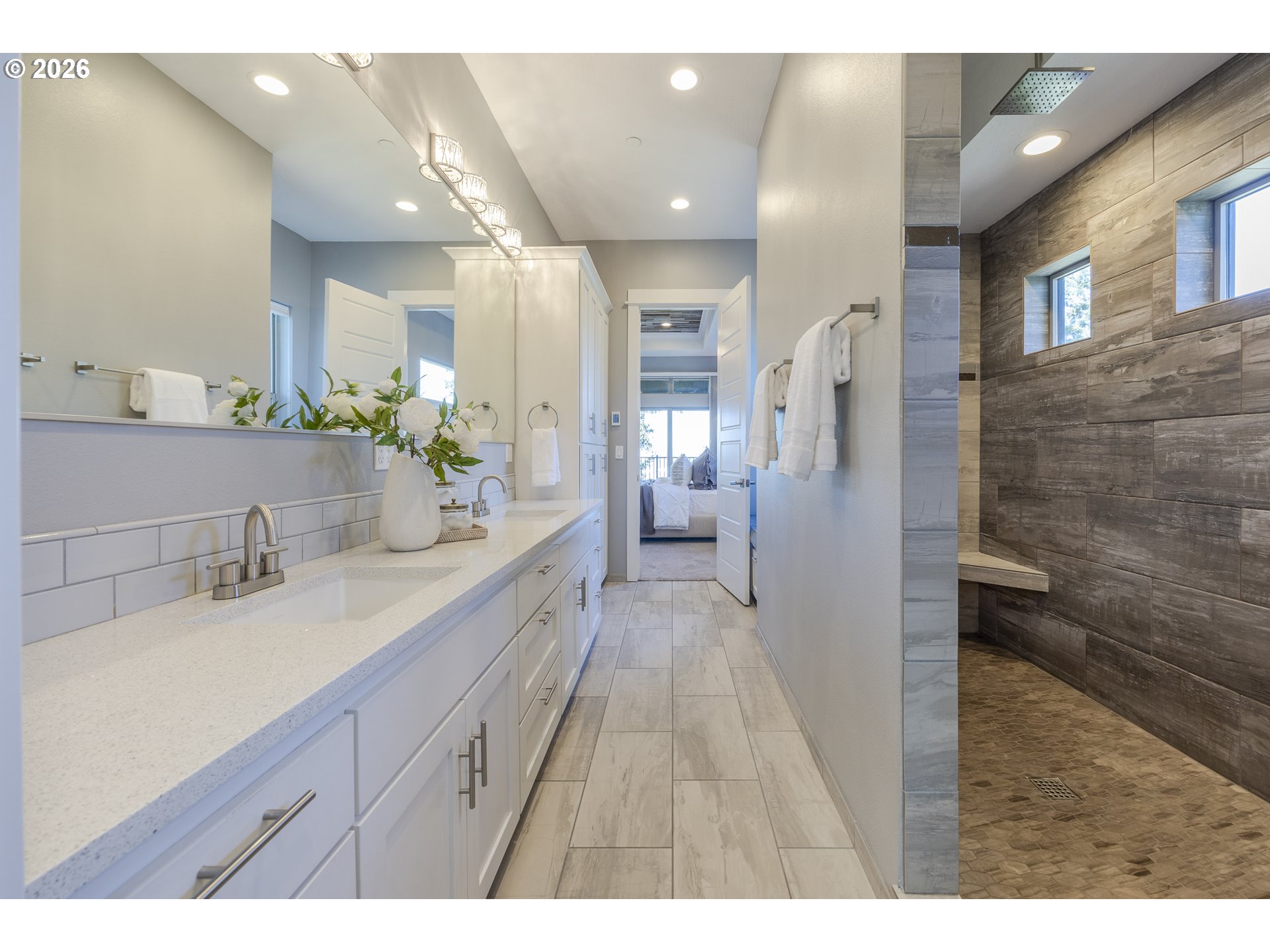 4048 Eagle View Drive Eugene, OR 97405 - Photo 26 of 48 a spacious bathroom with a sink mirror and shower