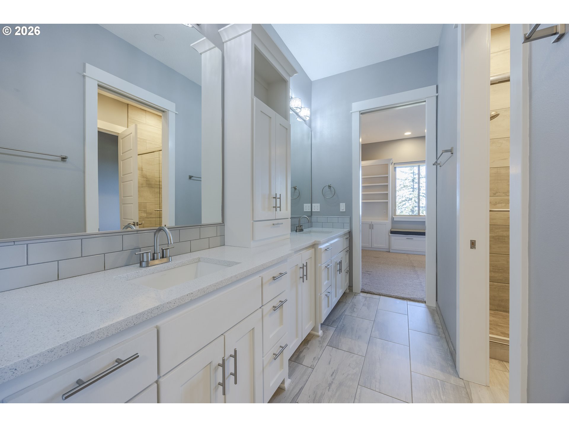 4048 Eagle View Drive Eugene, OR 97405 - Photo 32 of 48 a spacious bathroom with a double vanity sink and a mirror