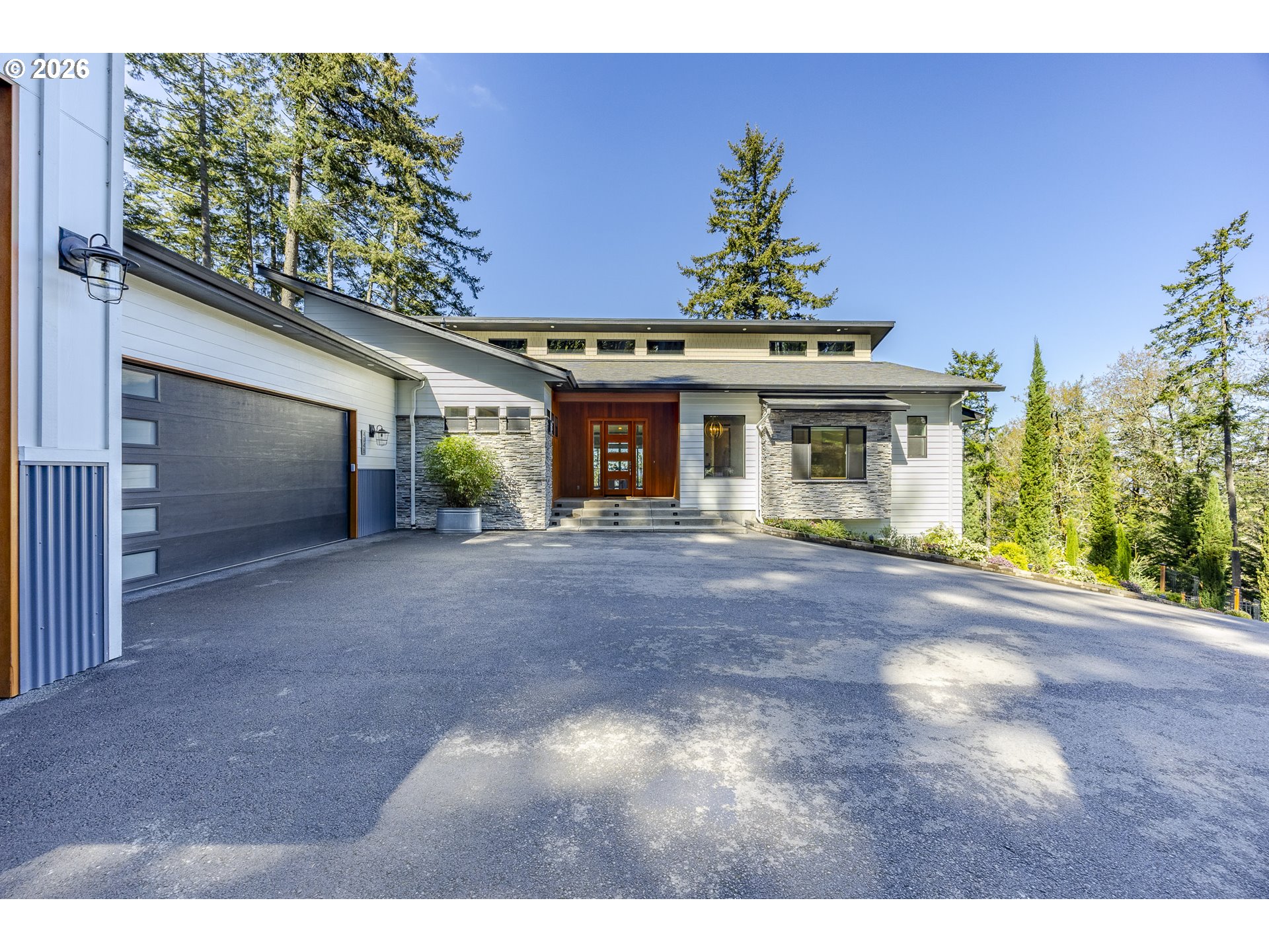 4048 Eagle View Drive Eugene, OR 97405 - Photo 5 of 48 a front view of a house with a yard and garage