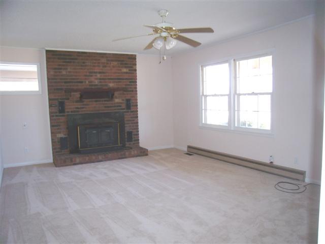350 Stevenson Circle Tennessee Ridge, TN 37178 - Photo 4 of 16 Living Room, brick hearth - wood fireplace w/insert.