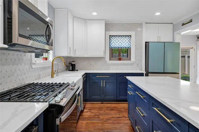 a kitchen with a stove and a sink