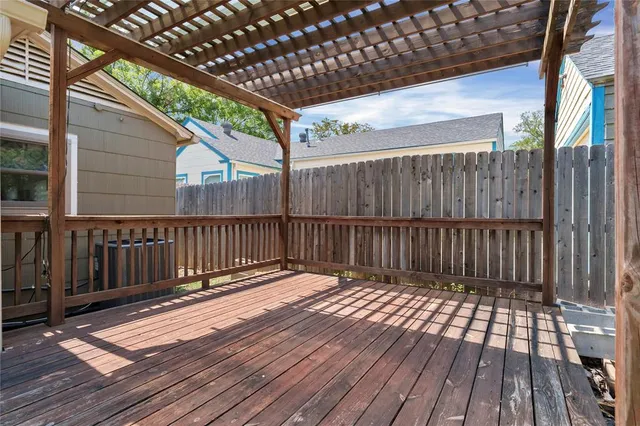 a view of a backyard with a small cabin and a chair