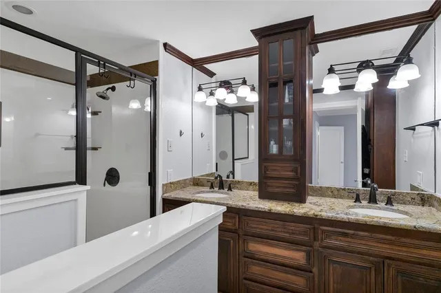 a bedroom with a bed and a lamp