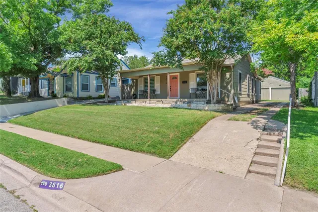 front view of a house with a garden