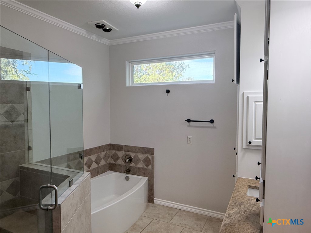1084 Frederick Lane Temple, TX 76502 - Photo 21 of 40 a bathroom with a bathtub and shower