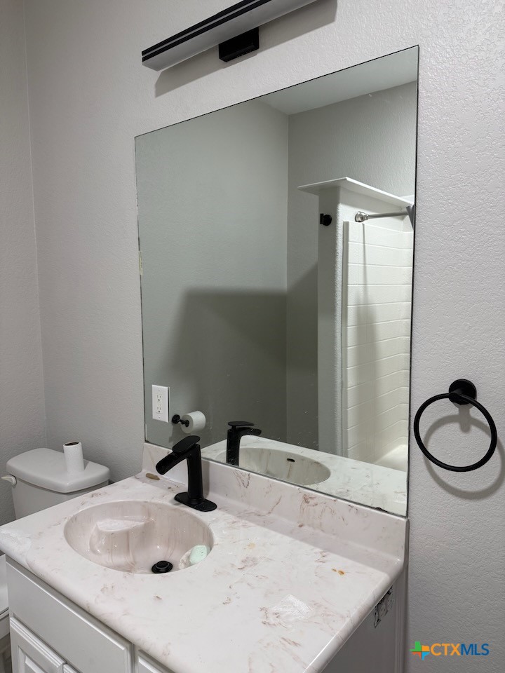 1084 Frederick Lane Temple, TX 76502 - Photo 29 of 40 a bathroom with a sink and a mirror