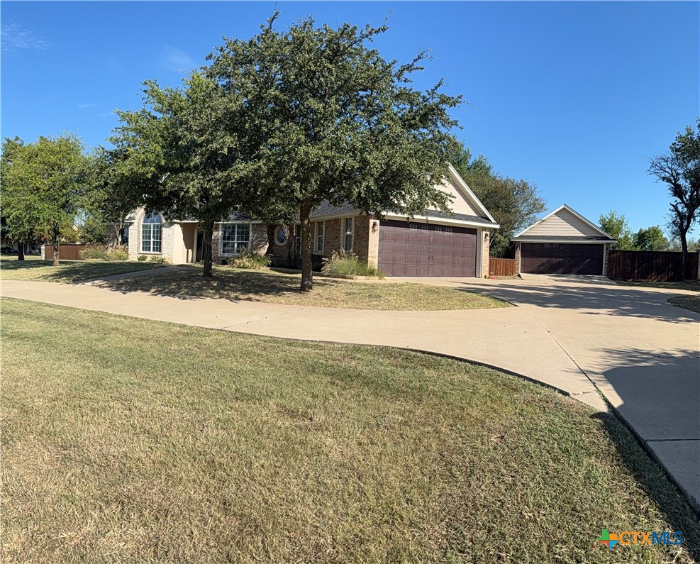 1084 Frederick Lane Temple, TX 76502 - Photo 3 of 40 a front view of a house with a yard and garage
