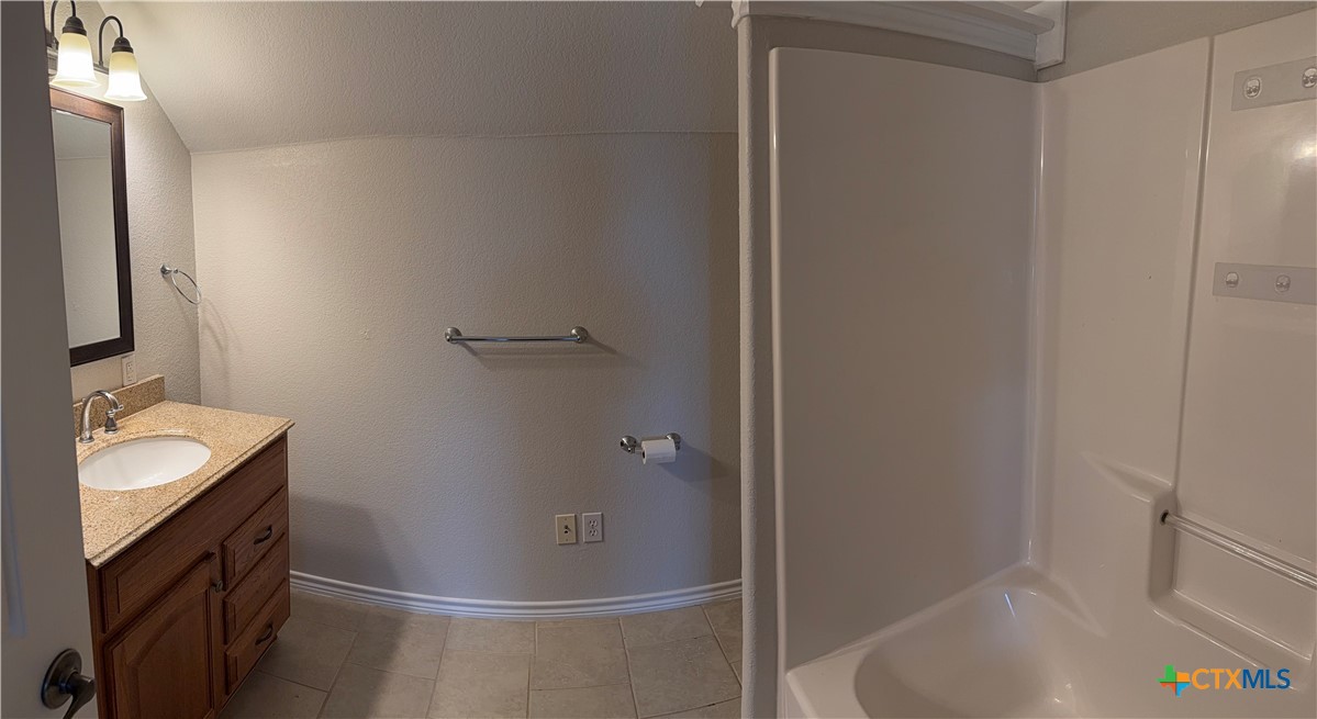 1084 Frederick Lane Temple, TX 76502 - Photo 37 of 40 a bathroom with a sink and shower