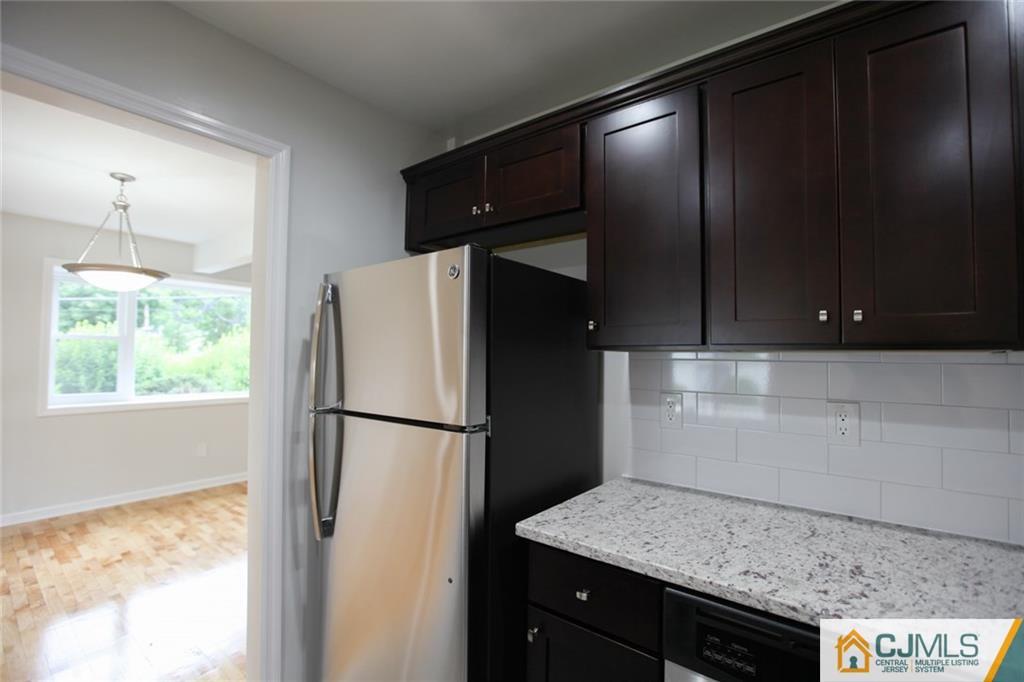 3008 Hana Road Edison, NJ 08817 - Photo 5 of 24 a white refrigerator freezer sitting inside of a kitchen