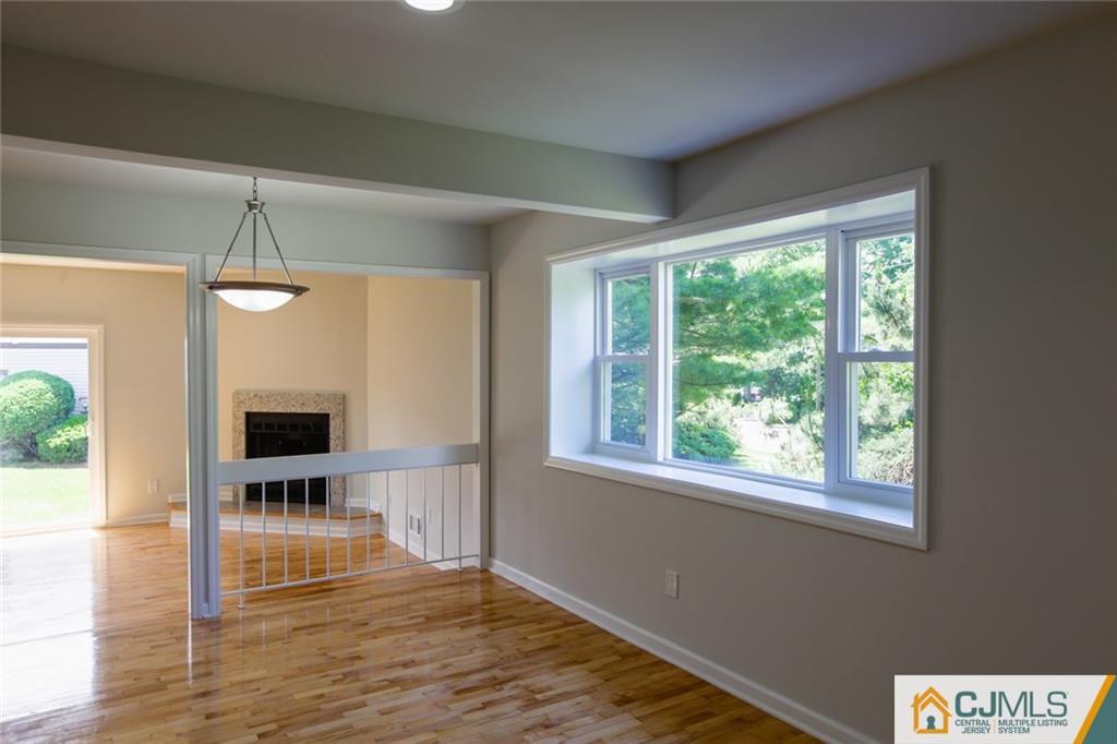 3008 Hana Road Edison, NJ 08817 - Photo 7 of 24 a view of a livingroom with wooden floor and a window