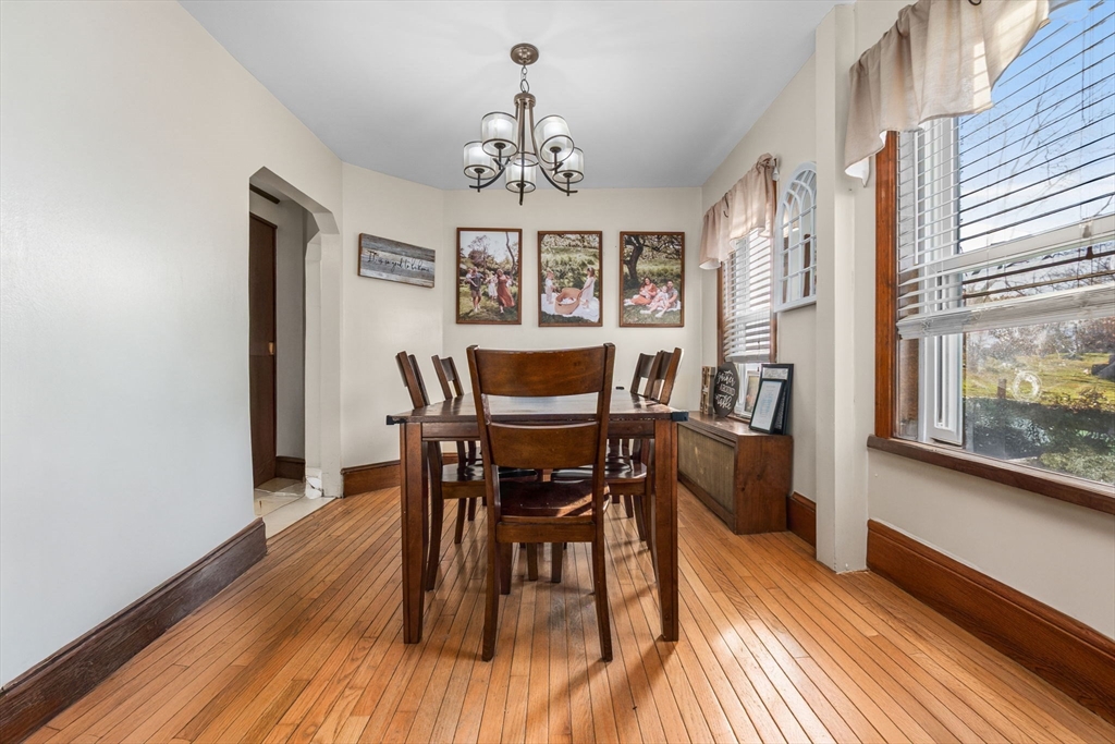 65 Poplar Street Gloucester, MA 01930 - Photo 12 of 23 a view of a dining room with furniture window and wooden floor